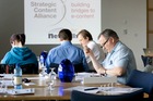 Deliberating previous day's work while waiting to start on day 2