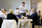 Steve discussing policy with table 3